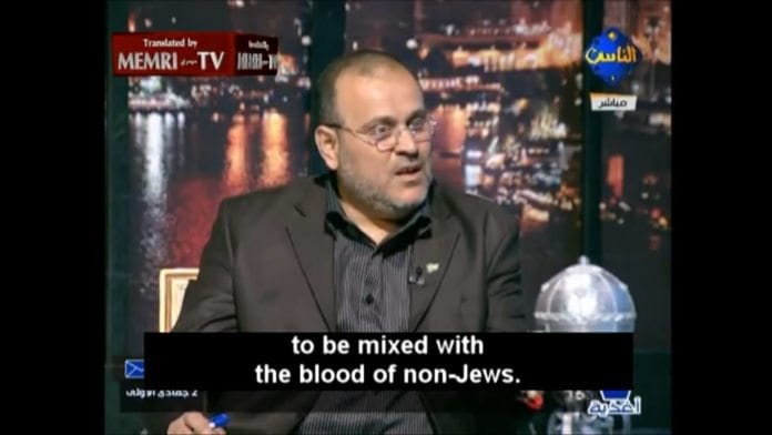 Osama Al-Mallouhi fra syrisk opposisjon drar fram gamle blødløgner mot jødene. (Skjermdump fra tv-stasjonen Al-Nas, via Memri) Osama Al-Mallouhi fra syrisk opposisjon drar fram gamle blødløgner mot jødene. (Skjermdump fra tv-stasjonen Al-Nas, via Memri)