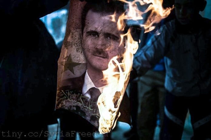Den hardt pressede syriske presidenten Bashar Assad (på bildet i flammer) har fått militær bistand fra Iran. (Foto: Freedom House) Den hardt pressede syriske presidenten Bashar Assad (på bildet i flammer) har fått militær bistand fra Iran. (Foto: Freedom House)
