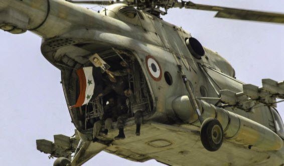 Soldater i et helikopter markerer støtte til president Bashar Assad. (Foto: FreedomHouse, flickr.com) Soldater i et helikopter markerer støtte til president Bashar Assad. (Foto: FreedomHouse, flickr.com)