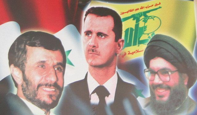 Hizbollah-produsert propagandaplakat hvor Irans president Mahmoud Ahmadinejad (f.v.), Syrias president Bashar Assad og Hizbollah-leder Hassan Nasrallah er avbildet. Fotografen har døpt bildet Hizbollah-produsert propagandaplakat hvor Irans president Mahmoud Ahmadinejad (f.v.), Syrias president Bashar Assad og Hizbollah-leder Hassan Nasrallah er avbildet. Fotografen har døpt bildet