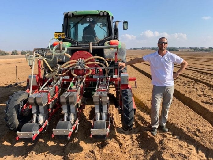 Dotan-Borentein-near-the-plow-sawing-Salicrop-seeds-in-the-fields-surrounding-Gaaza-Strip.-credit-Salicrop